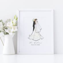 Framed artwork of a bride and groom with flowers on a white surface