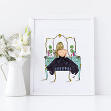 Framed artwork of a woman in a black dress sitting on a bench with flowers in a vase next to it.